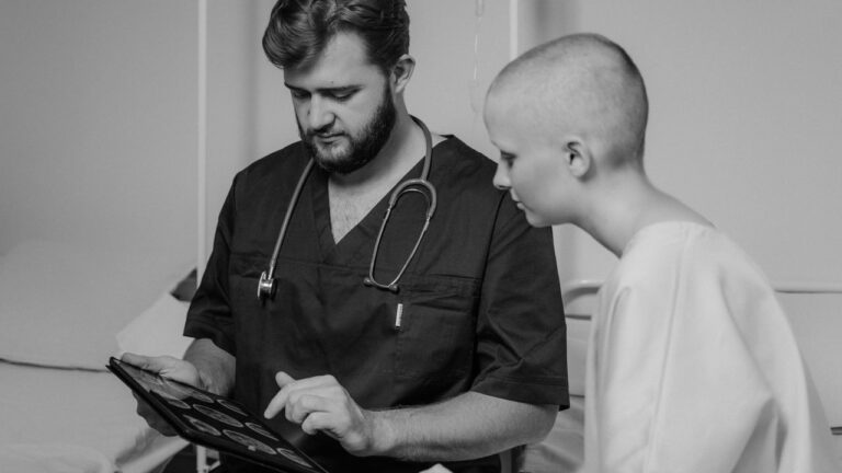 Doctor and patient reviewing information on a digital tablet, representing DrChrono integrations